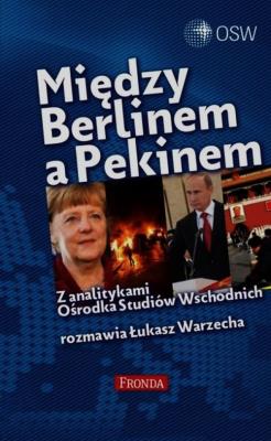 Między Berlinem a Pekinem. Autor: Łukasz Warzecha. SmakLiter.pl Okładka książki Między Berlinem a Pekinem
