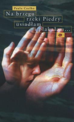 Na brzegu rzeki Piedry usiadłam i płakałam..w.2019. Autor: Paulo Coelho. SmakLiter.pl Okładka książki Na brzegu rzeki Piedry usiadłam i płakałam..w.2019