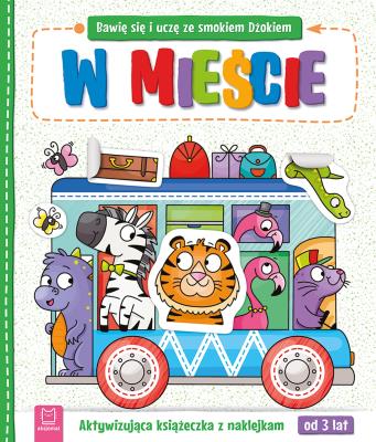 Okładka książki Bawię się i uczę ze smokiem Dżokiem. W mieście. Aktywizująca książeczka z naklejkami od 3 lat
