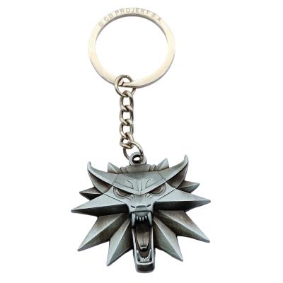 Brelok The Witcher Wiedźmin Wolf Medallion. Wydawca: GOOD LOOT. SmakLiter.pl Opakowanie Brelok The Witcher Wiedźmin Wolf Medallion