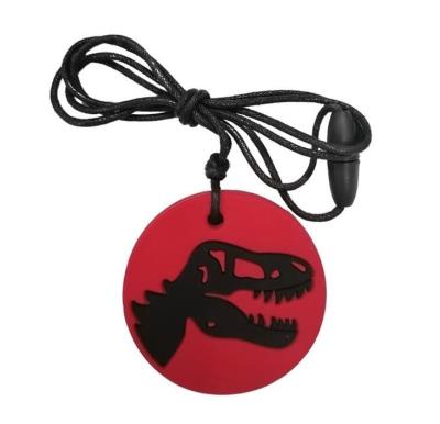 Opakowanie Gryzak antystresowy naszyjnik - dinozaur czerwony