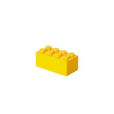 Lego pudełeczko klocek ósemka żółty. Wydawca: NHG. SmakLiter.pl Opakowanie Lego pudełeczko klocek ósemka żółty