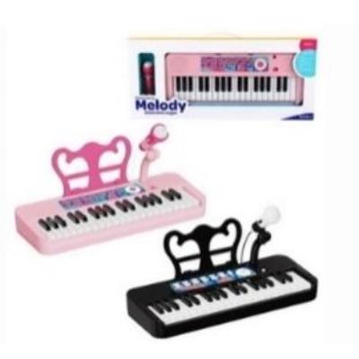 Pianinko muzyczne z mikrofonem 55x7,6x24,3cm MIX. Wydawca: Madej. SmakLiter.pl Opakowanie Pianinko muzyczne z mikrofonem 55x7,6x24,3cm MIX