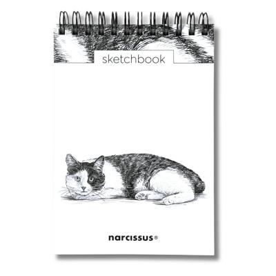 Szkicownik A6/60K na spirali - Kot. Wydawca: Narcissus. SmakLiter.pl Opakowanie Szkicownik A6/60K na spirali - Kot