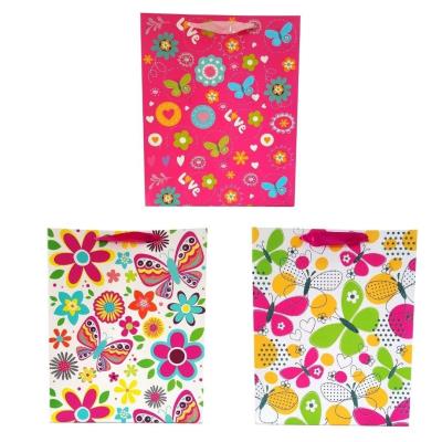 Torebka prezentowa uniwersalna L Kwiaty motyle MIX. Wydawca: JU-PITER. SmakLiter.pl Opakowanie Torebka prezentowa uniwersalna L Kwiaty motyle MIX