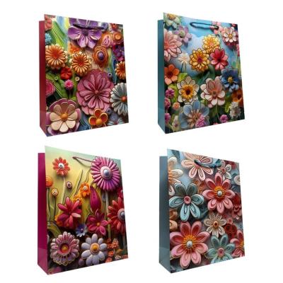 Torebka prezentowa uniwersalna S Kwiaty metal mix. Wydawca: JU-PITER. SmakLiter.pl Opakowanie Torebka prezentowa uniwersalna S Kwiaty metal mix