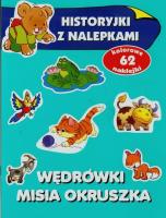 Wędrówki misia Okruszka Historyjki z nalepkami. Autor: Anna Wiśniewska (red.). SmakLiter.pl Okładka książki Wędrówki misia Okruszka Historyjki z nalepkami