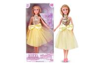 Lalka Natalia na przyjęciu w żółtej sukience 29 cm. Wydawca: Artyk. SmakLiter.pl Opakowanie Lalka Natalia na przyjęciu w żółtej sukience 29 cm