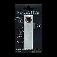 Odblaskowy breloczek Tech Line - Biały pasek. Wydawca: MG. SmakLiter.pl Opakowanie Odblaskowy breloczek Tech Line - Biały pasek